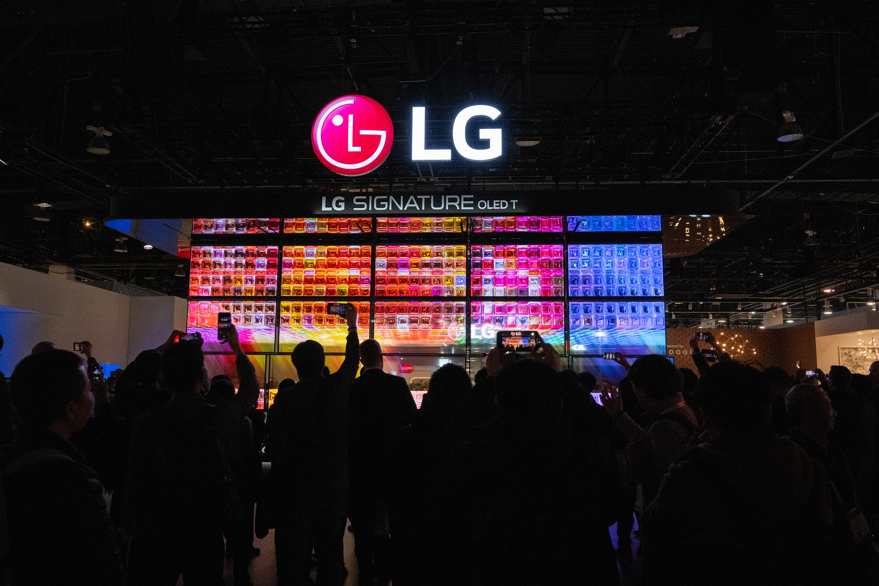The moving wall of several Signature OLED Ts—the new 4K wireless transparent OLED TV