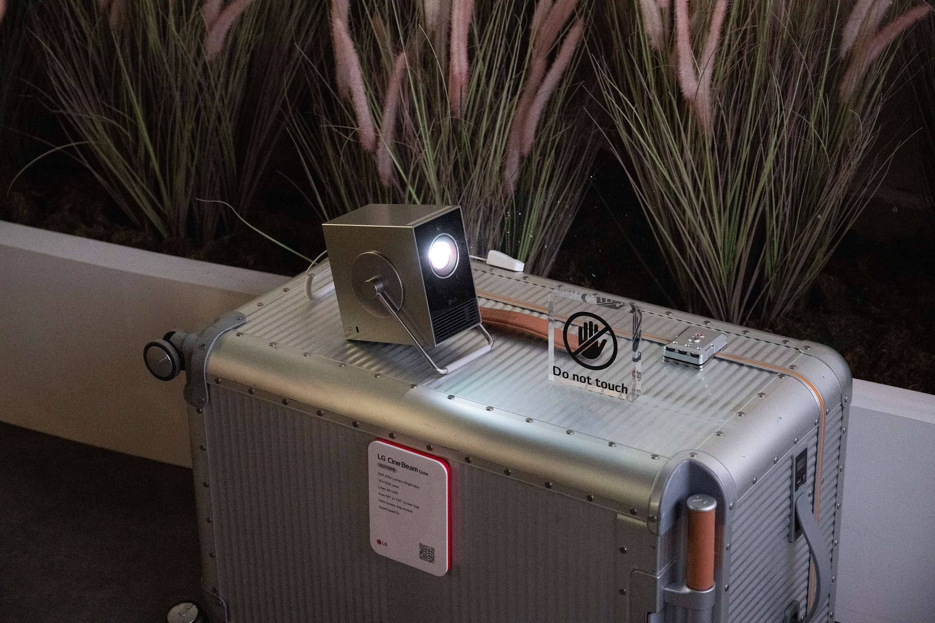 The fashionable CineBeam Qube projector was set up in a faux camping scene.