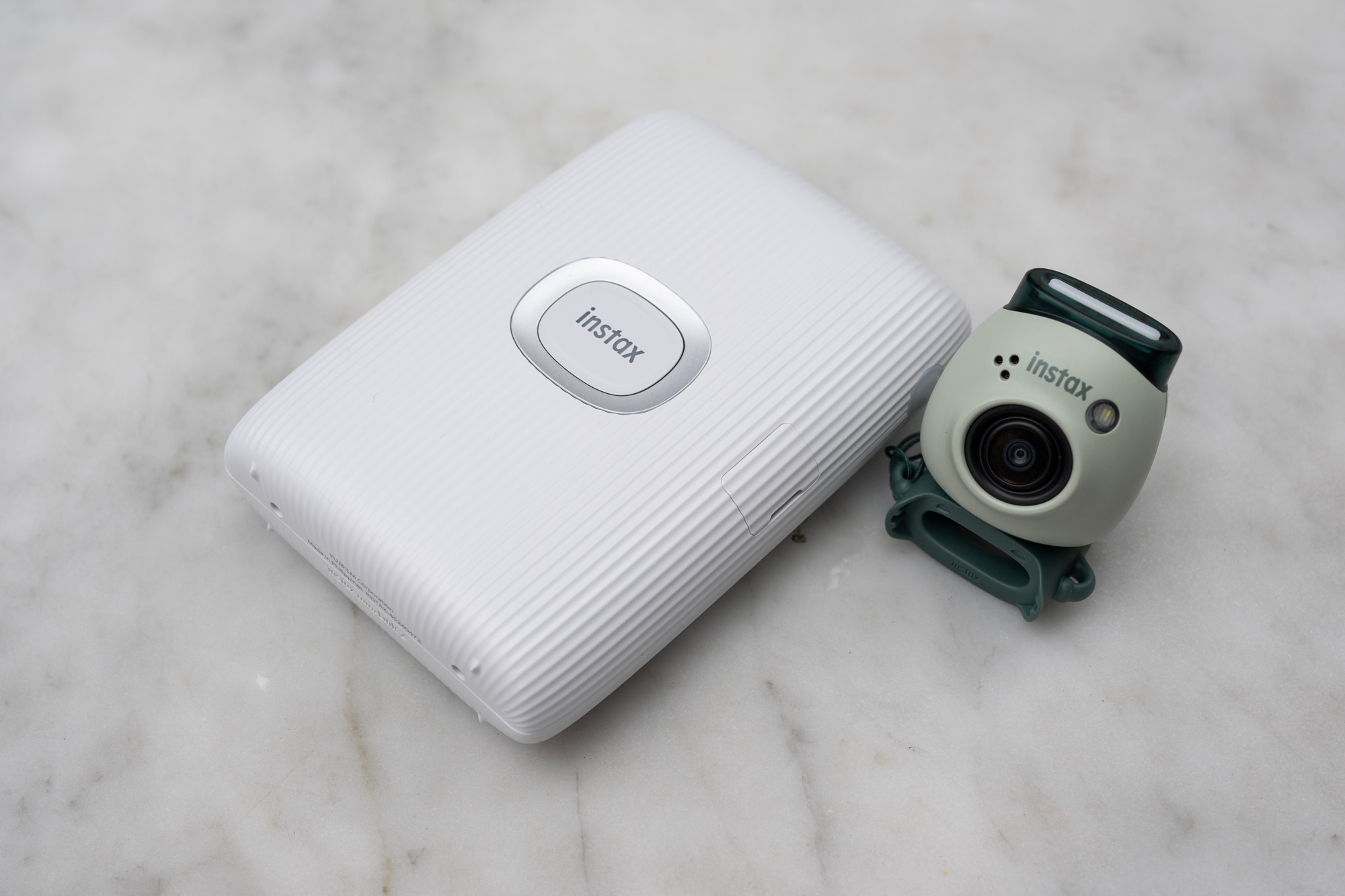 The INSTAX Pal with the INSTAX MINI LINK 2 Smartphone Printer.