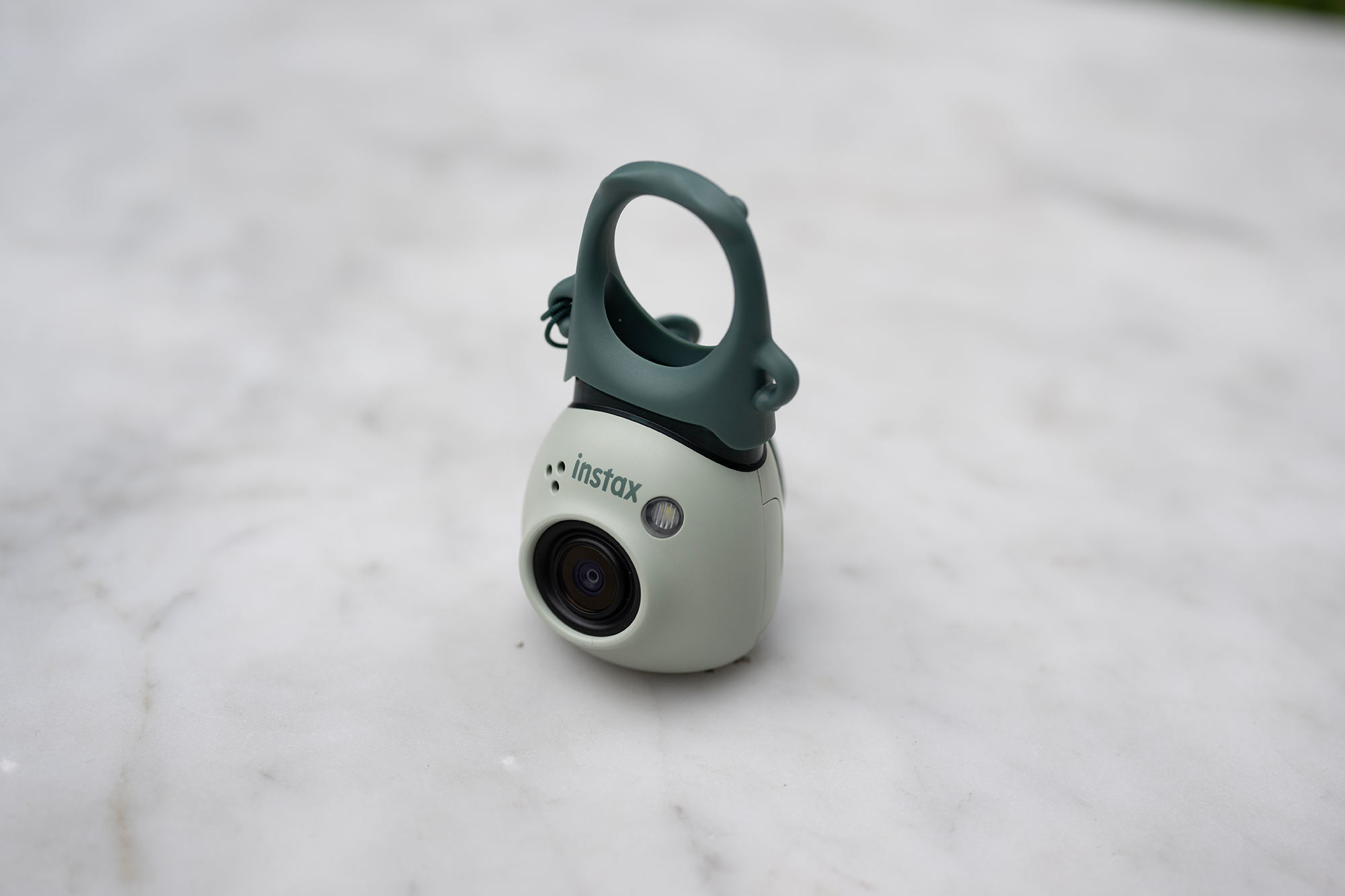 The INSTAX Pal with viewfinder attachment.