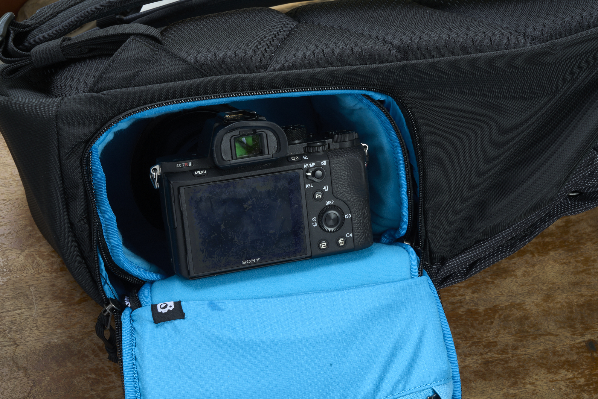 The interior camera case was designed for small mirrorless cameras and short lenses