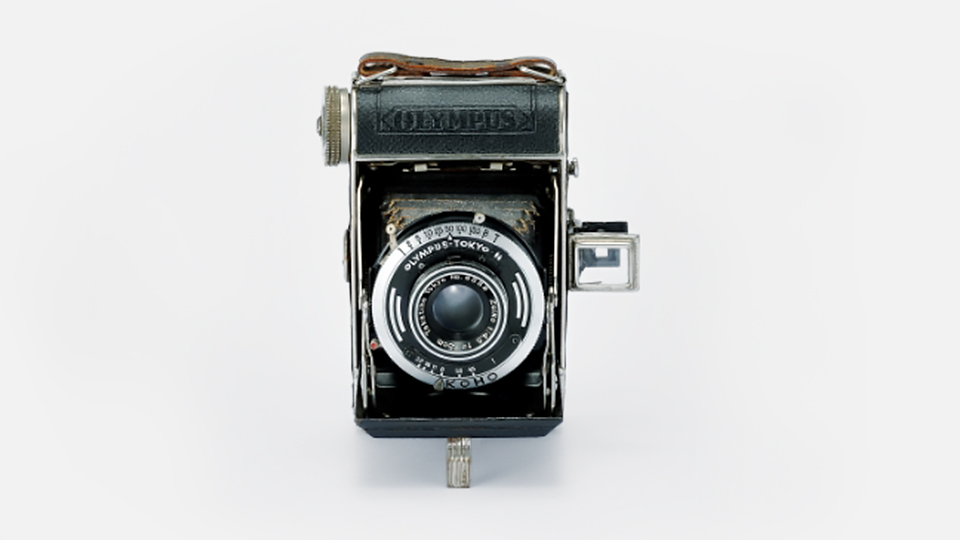 Semi Olympus-I Camera with a ZUIKO Lens