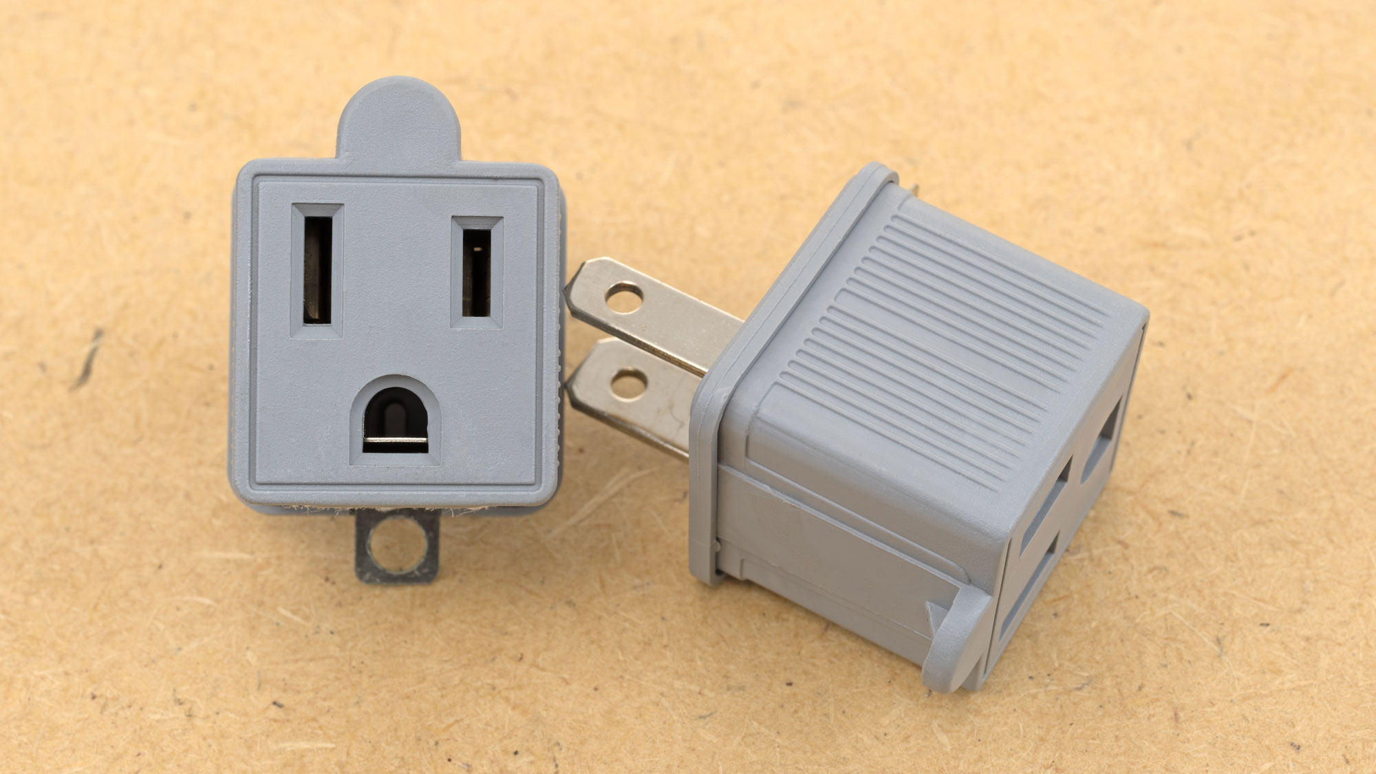 3-2 prong adapters have a small metal tab on the bottom that is used for grounding.